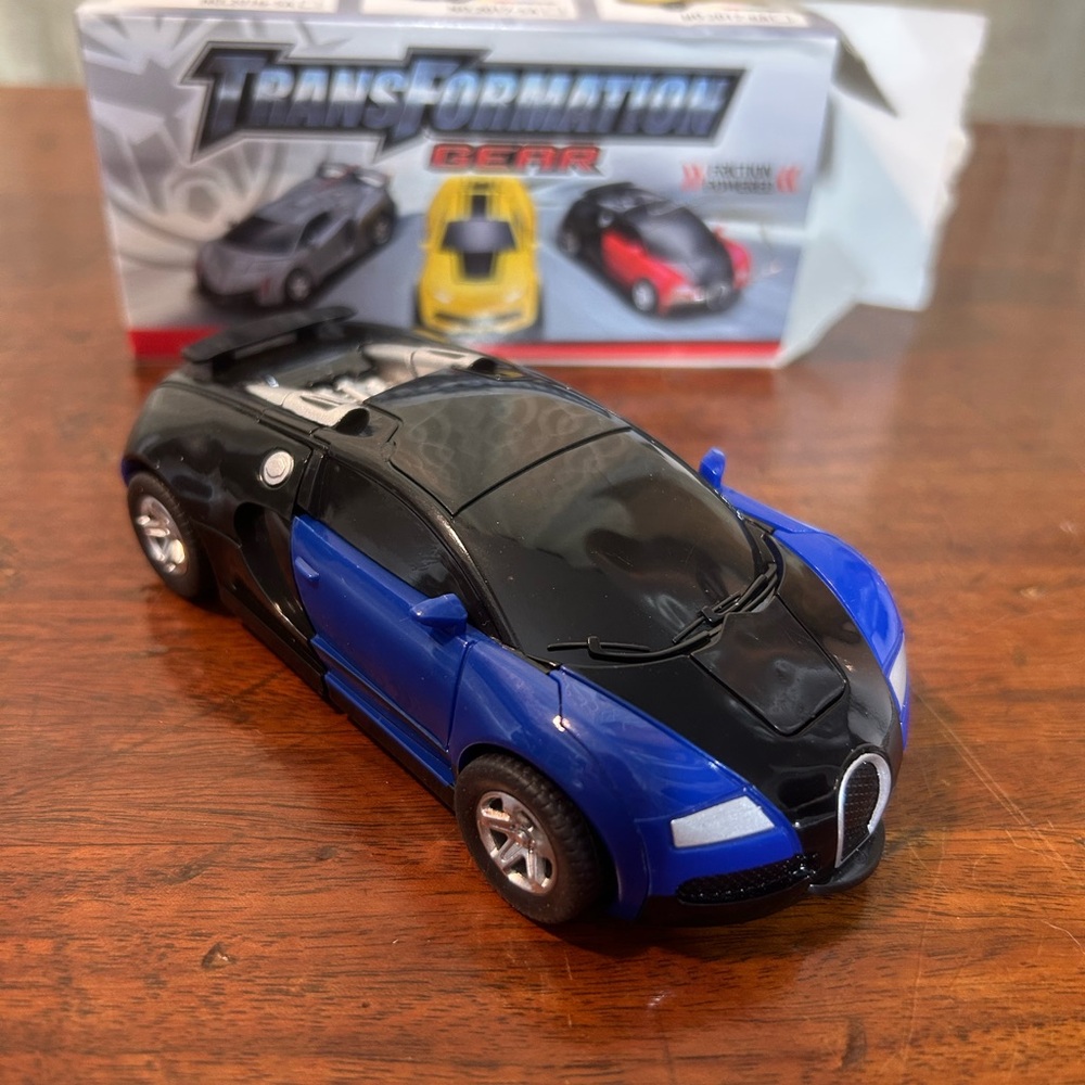 “Transformation” Gear Friction Powered
Transform car Robot